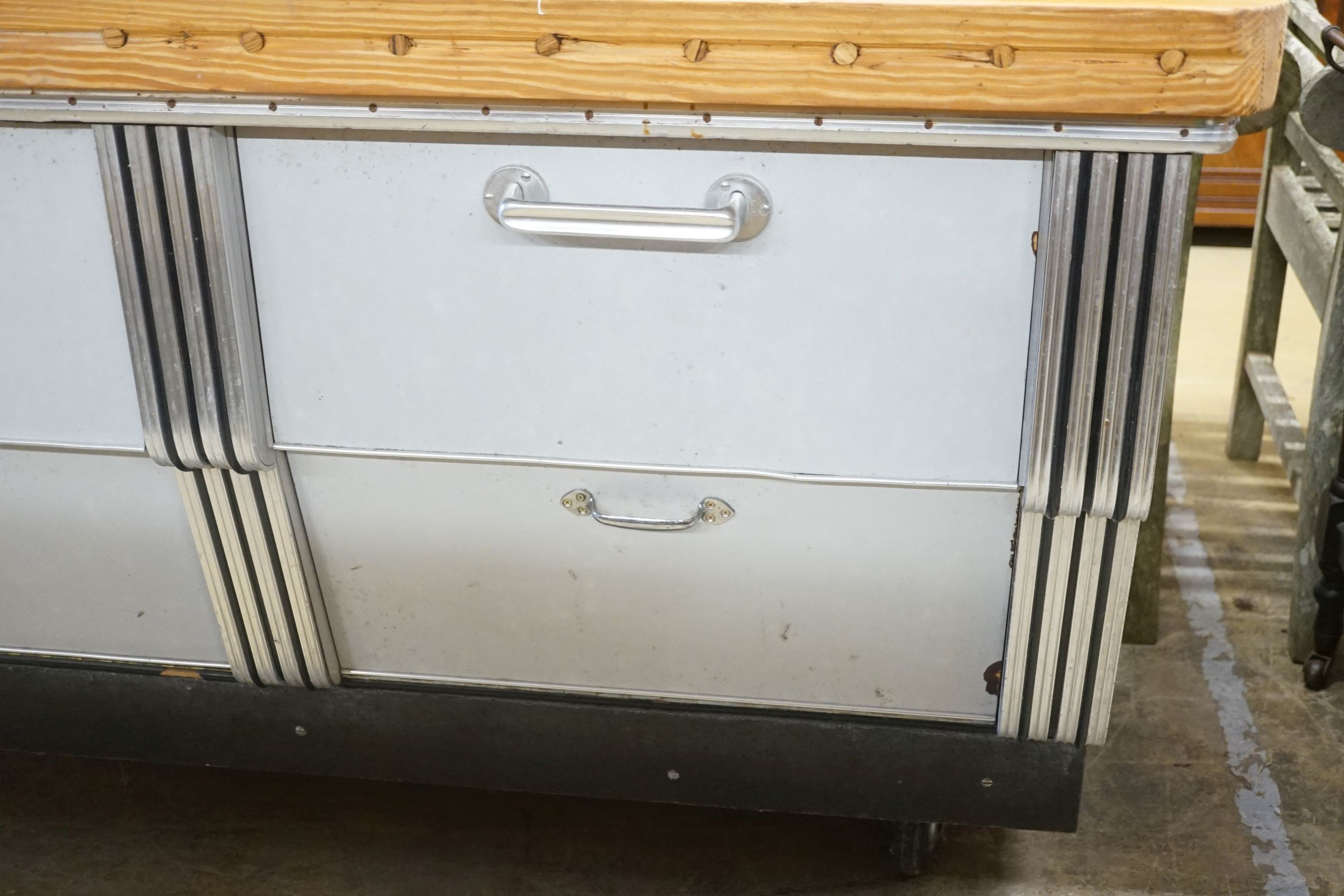 A mid 20th century shop counter cabinet with pine strip work top, width 152cm depth 71cm height 88cm